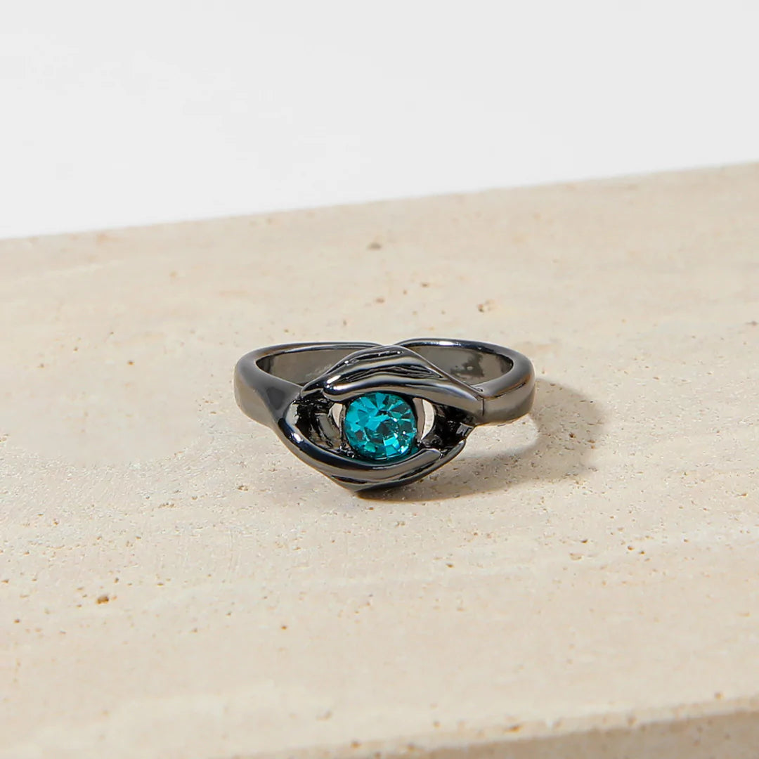 Ewige Liebe-Ring – auffälliger schwarzer Ring mit blauem Stein als elegantes Statement