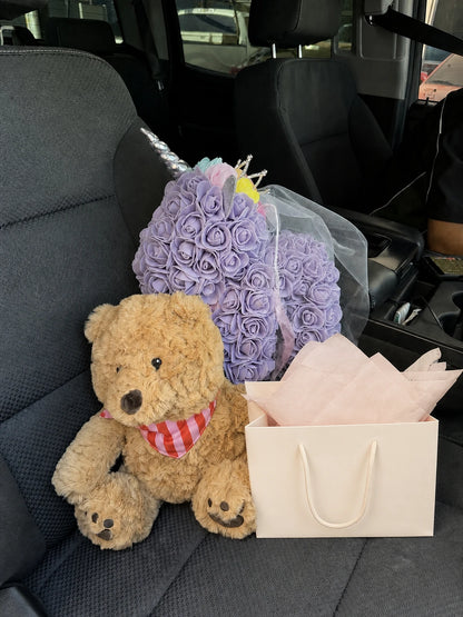 Lavender rose unicorn displayed on a neutral car seat
